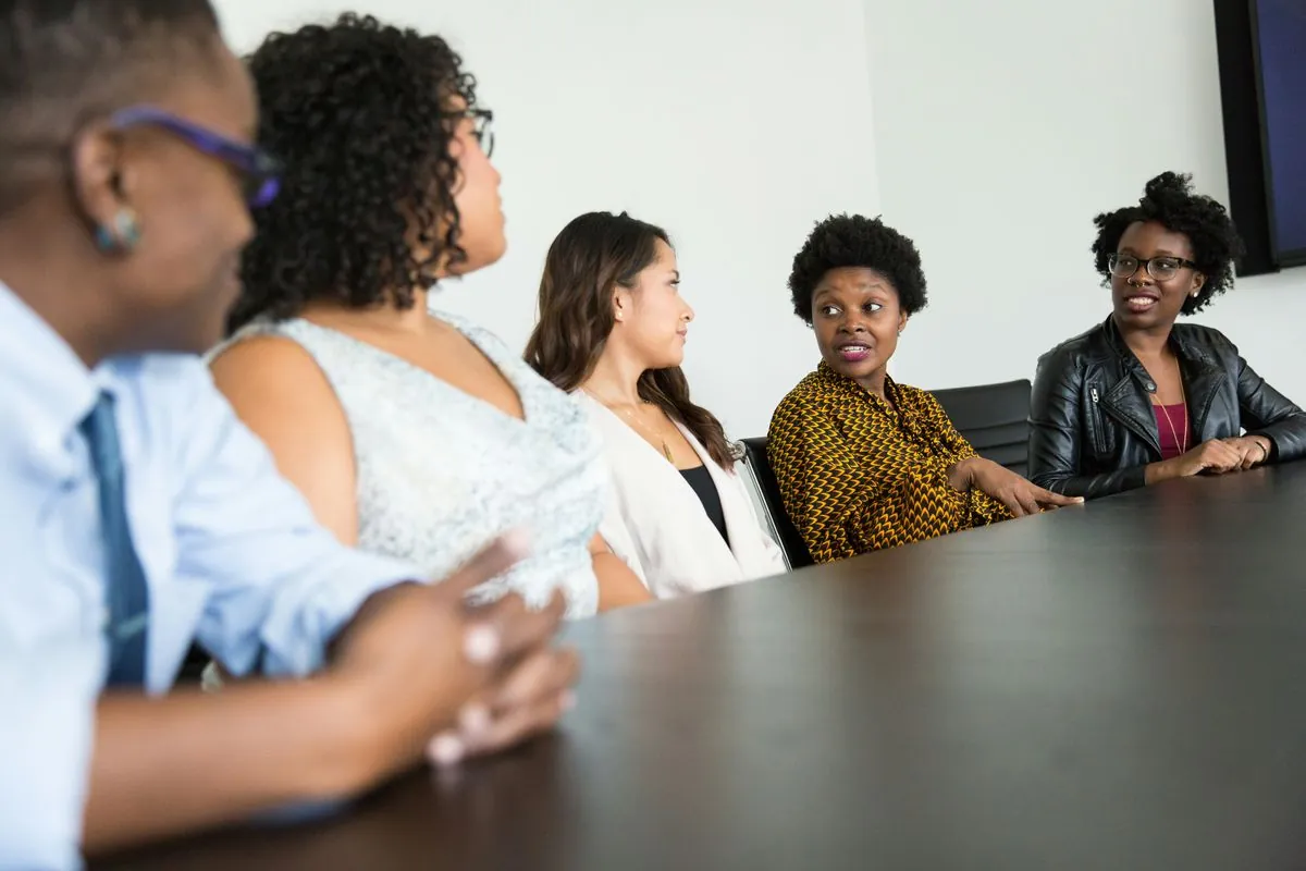 A team in conversation around a boardroom table